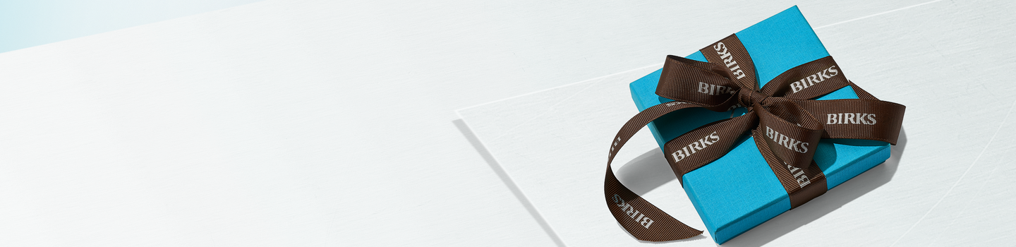 A Maison Birks blue box on a white background.